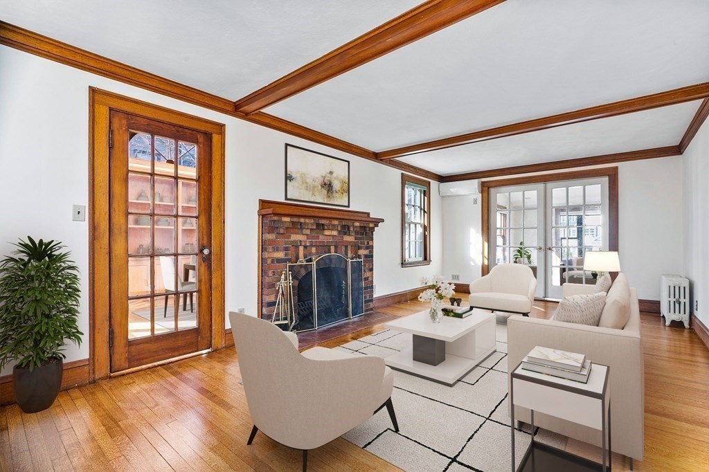 8 Parker Road Winchester, MA 01890 - Photo 7 of 37 a living room with fireplace furniture and a wooden floor