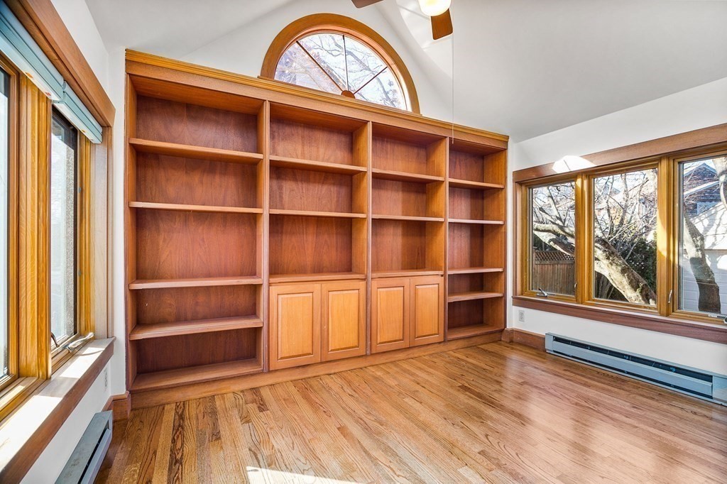 8 Parker Road Winchester, MA 01890 - Photo 10 of 37 a view of an empty room with a window and wooden floor