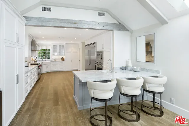 a living room with furniture flat screen tv and a fireplace