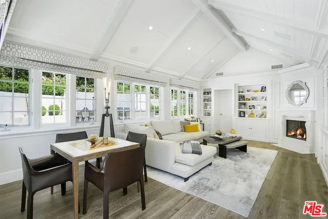 a bedroom with a bed couch and a window