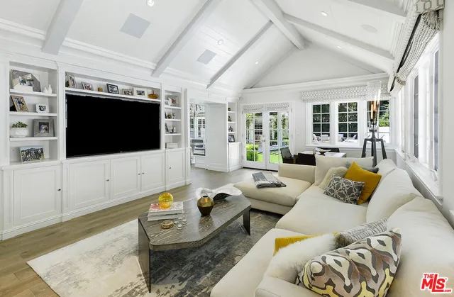 a en suite bathroom with a granite countertop sink and a mirror