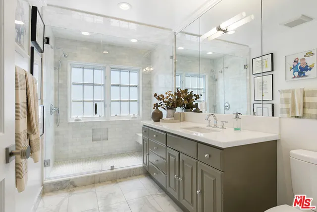 a view of a porch with chairs and a table