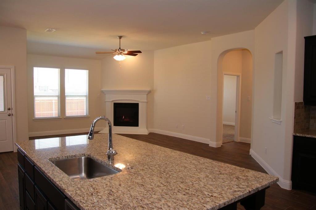 224 Gill Point Lane Aledo, TX 76008 - Photo 9 of 22 A view of the family room and the entry to the Primary suite