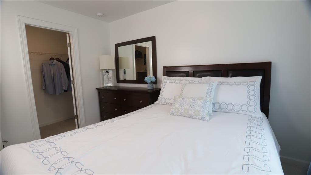 205 Lakeside Place Canton, GA 30114 - Photo 65 of 65 a bedroom with a bed and a closet