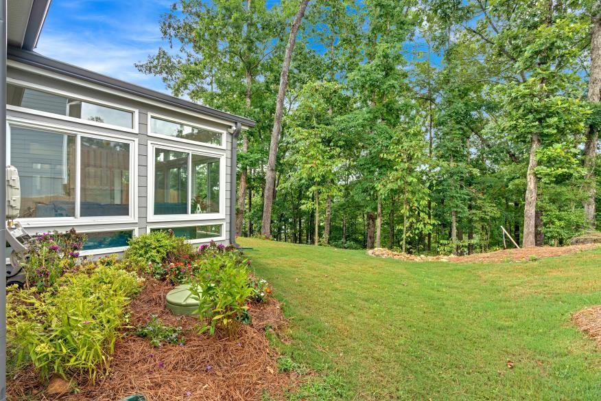 205 Lakeside Place Canton, GA 30114 - Photo 10 of 65 front view of a house with a yard