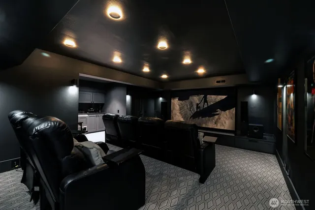 a front view of a house with outdoor seating