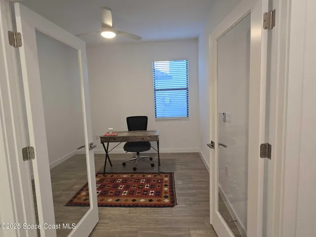 a view of a workspace with furniture