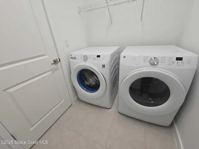 a utility room with dryer and washer