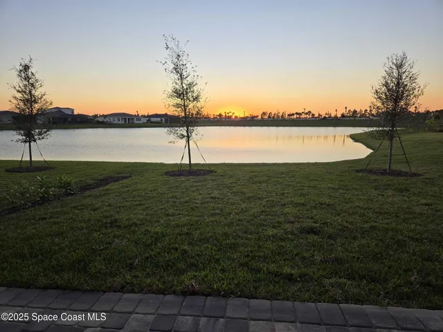 a view of a lake with a big yard