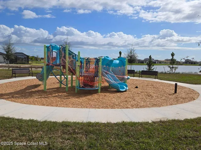 a view of a park with swings and slides