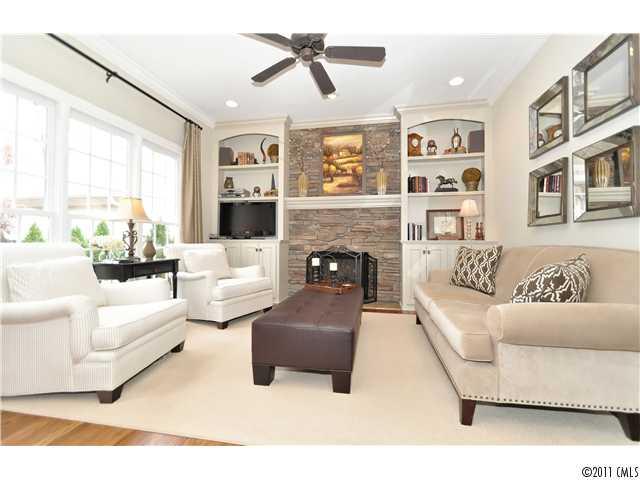 805 Millbrook Road Charlotte, NC 28211 - Photo 8 of 16 a living room with furniture fireplace and a large window
