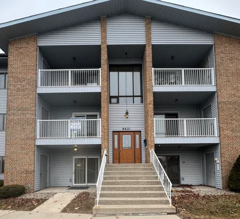 a front view of a house with a balcony