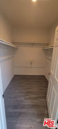 a bathroom with a toilet sink and a mirror