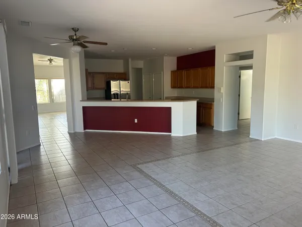 a view of a kitchen with a sink and a living room