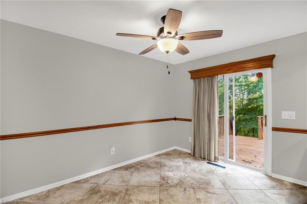 7511 McGee Road Rural Hall, NC 27045 - Photo 13 of 39 Dining Area with sliding glass door to rear deck
