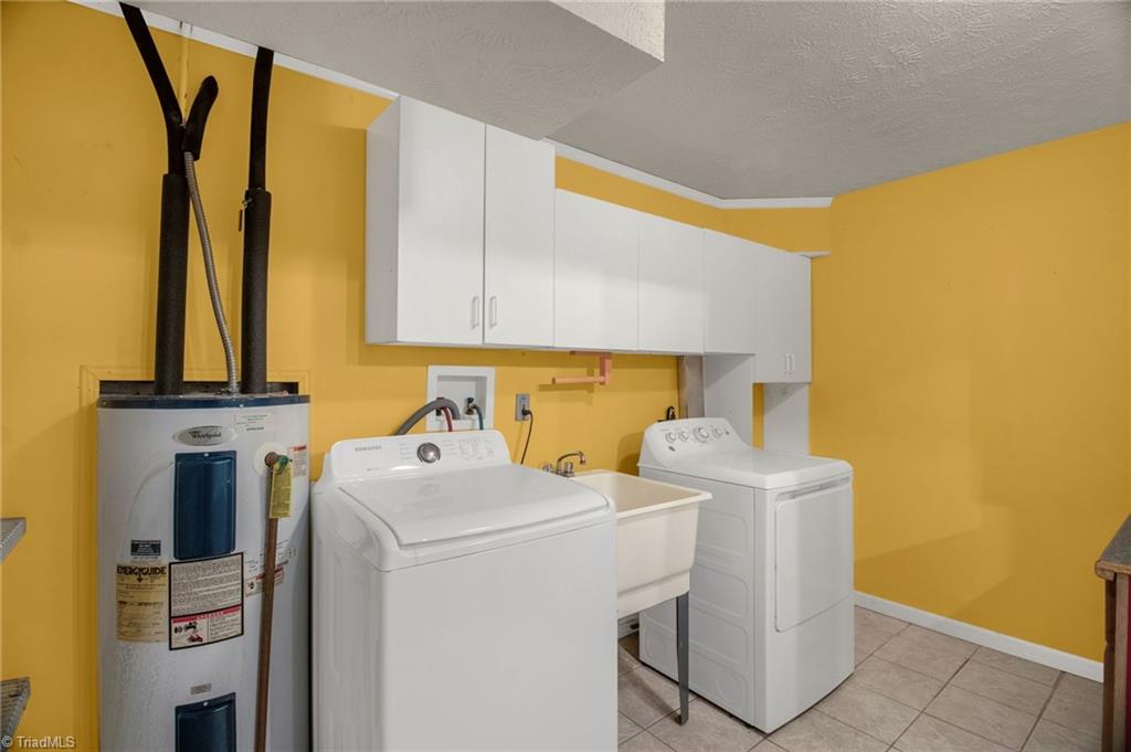 7511 McGee Road Rural Hall, NC 27045 - Photo 20 of 39 Large Laundry room with sink & cabinets