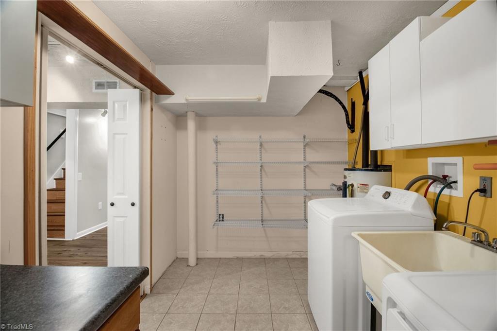 7511 McGee Road Rural Hall, NC 27045 - Photo 21 of 39 Laundry Room with sink & plenty of storage space