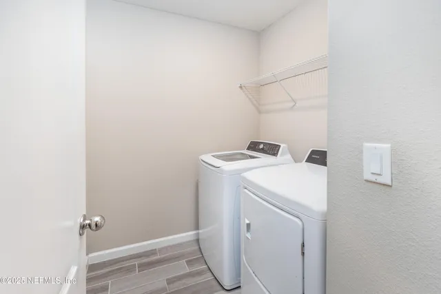 a bathroom with a sink toilet and a mirror