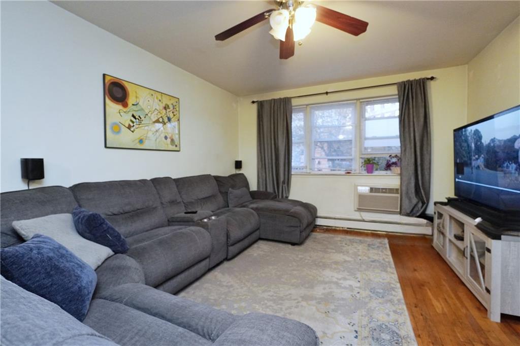 4 Ave Y Brooklyn, NY 11214 - Photo 11 of 25 a living room with furniture and a flat screen tv
