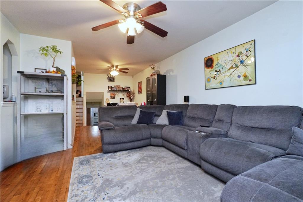 4 Ave Y Brooklyn, NY 11214 - Photo 12 of 25 a living room with furniture and a chandelier