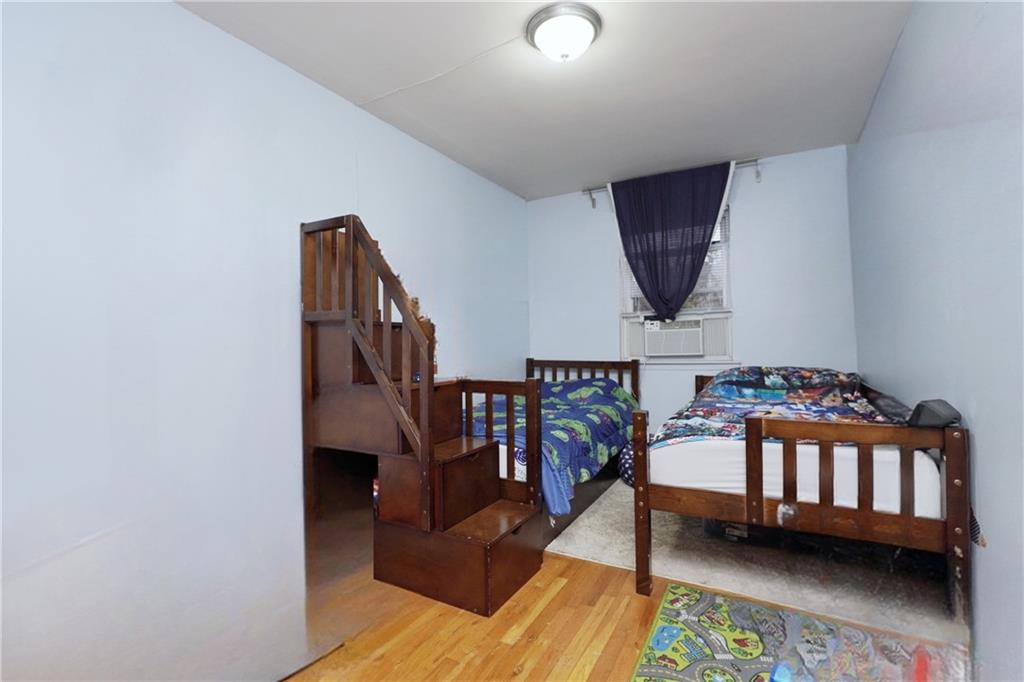 4 Ave Y Brooklyn, NY 11214 - Photo 17 of 25 a bedroom with furniture and a baby crib