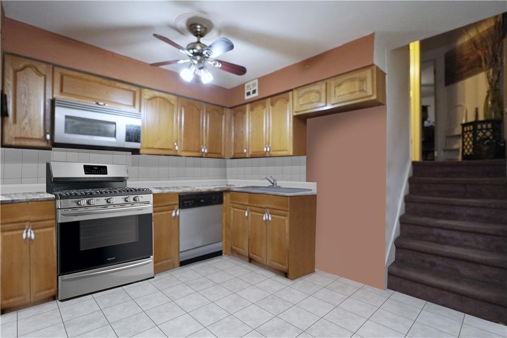 4 Ave Y Brooklyn, NY 11214 - Photo 7 of 25 a kitchen with cabinets a sink and appliances