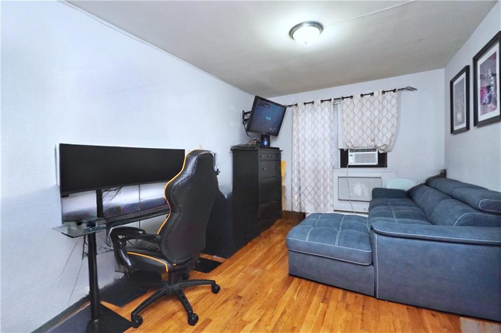4 Ave Y Brooklyn, NY 11214 - Photo 10 of 25 a living room with furniture and a wooden floor