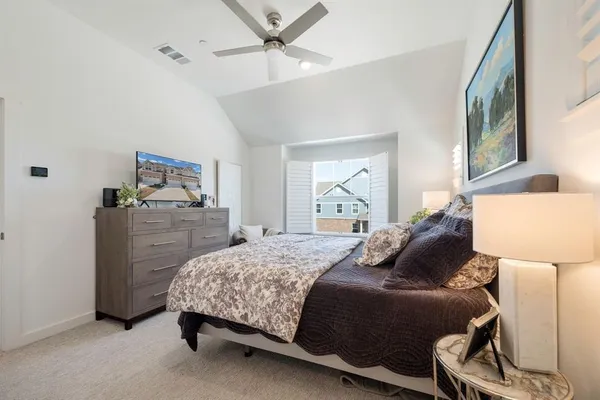 a bedroom with a bed and window