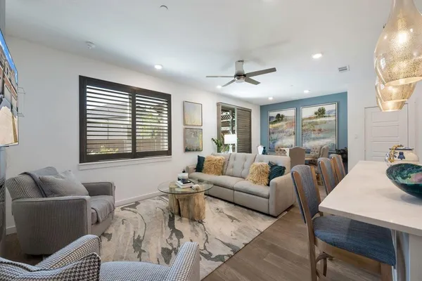 a living room with furniture and a large window