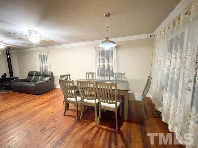 1020 Reca Road Garner, NC 27529 - Photo 6 of 20 a view of a dining room with furniture wooden floor and chandelier