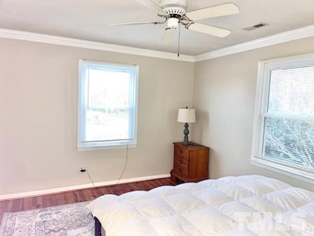 1020 Reca Road Garner, NC 27529 - Photo 10 of 20 a bedroom with a bed and a window