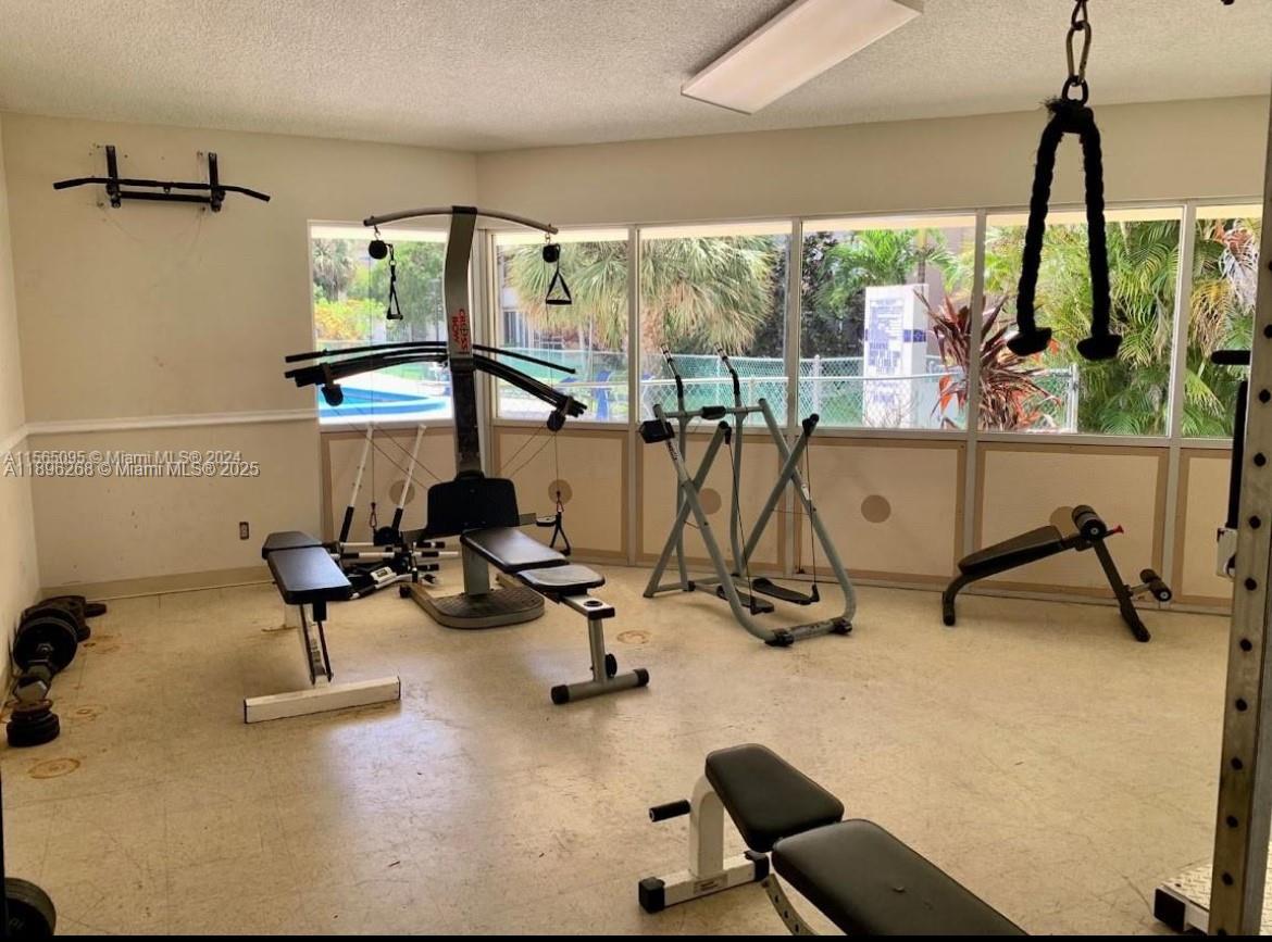 319 Northeast 14th Avenue, Unit 702 Hallandale Beach, FL 33009 - Photo 11 of 12 a view of a room with gym equipment