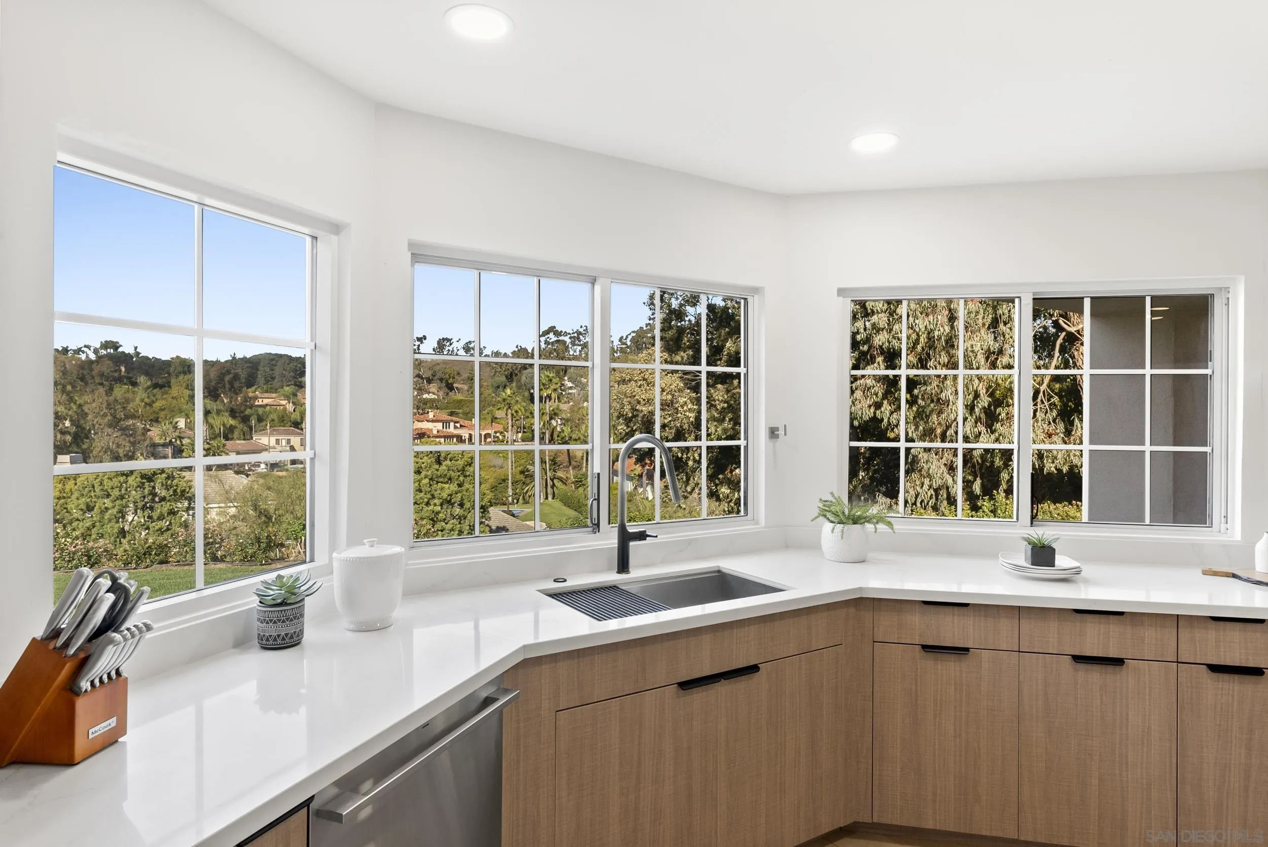 17515 Circa Oriente Rancho Santa Fe, CA 92067 - Photo 14 of 37 Won't be a problem doing dishes in this beautiful setting with fantastic views.