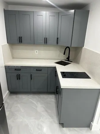 a utility room with a sink