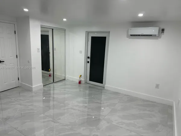 an empty room with entrance and door