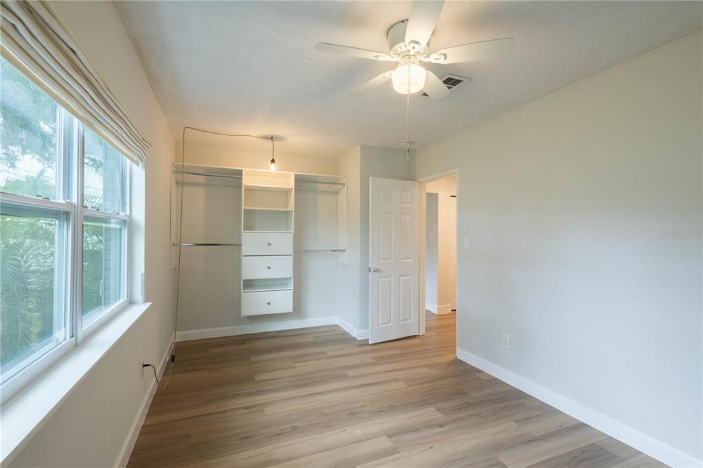 314 4th Avenue Southwest Ruskin, FL 33570 - Photo 14 of 30 a view of an empty room with a window and wooden floor