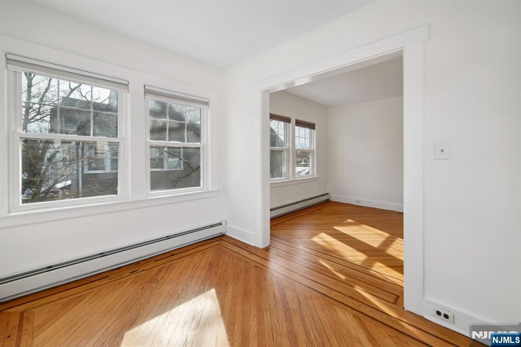 42 Brookfield Road, Unit 2 Montclair, NJ 07043 - Photo 11 of 36 a view of empty room with wooden floor and fan