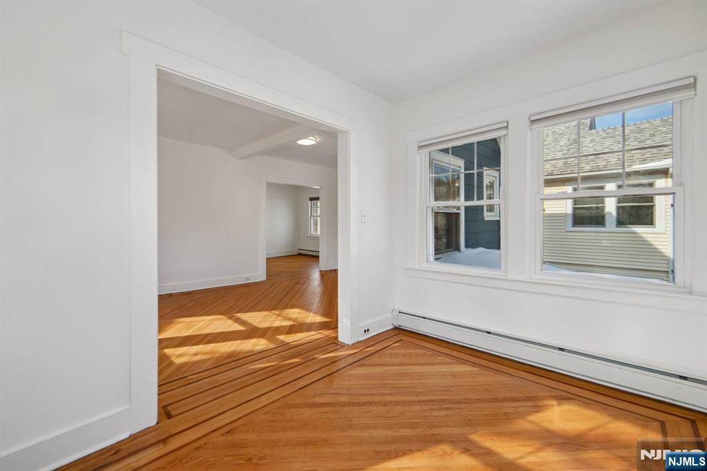 42 Brookfield Road, Unit 2 Montclair, NJ 07043 - Photo 12 of 36 a view of empty room with wooden floor and fan