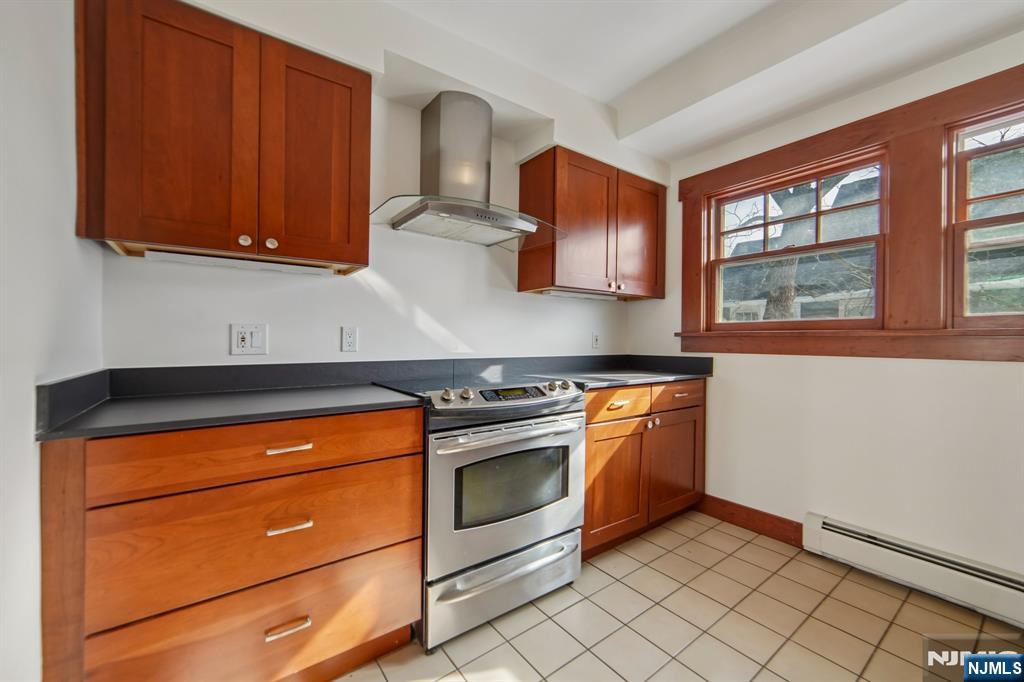 42 Brookfield Road, Unit 2 Montclair, NJ 07043 - Photo 14 of 36 a kitchen with stainless steel appliances granite countertop a stove and a microwave