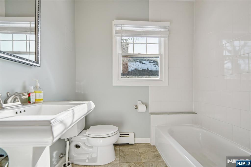 42 Brookfield Road, Unit 2 Montclair, NJ 07043 - Photo 16 of 36 a white toilet sitting next to a bath tub