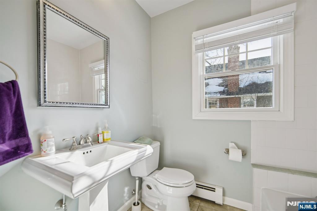 42 Brookfield Road, Unit 2 Montclair, NJ 07043 - Photo 17 of 36 a bathroom with a sink toilet and mirror