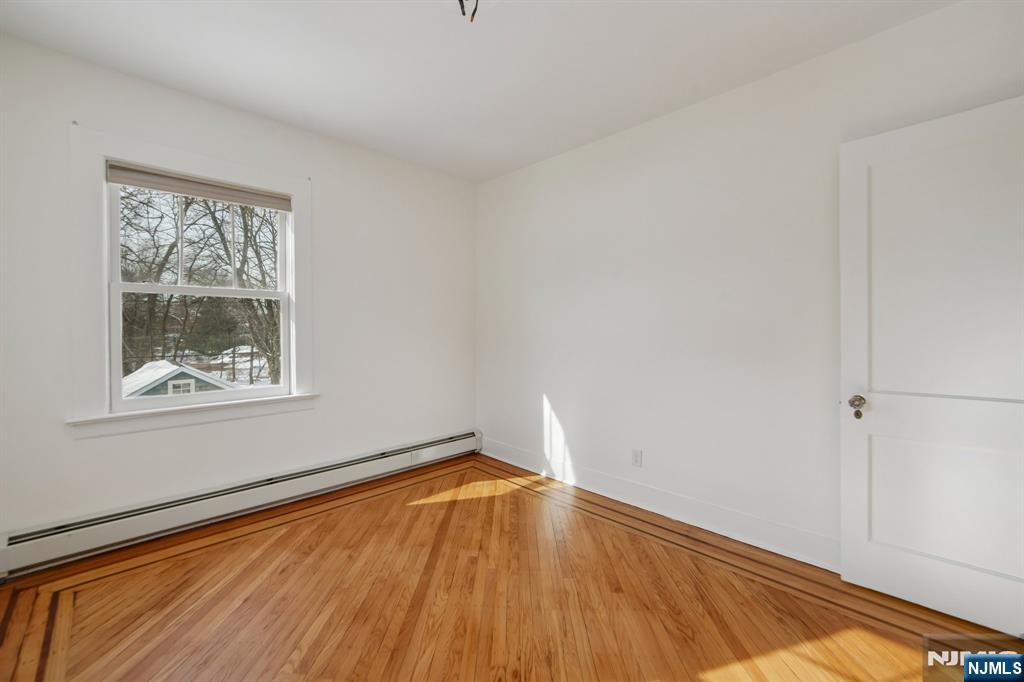 42 Brookfield Road, Unit 2 Montclair, NJ 07043 - Photo 19 of 36 a view of a room with wooden floor and small window