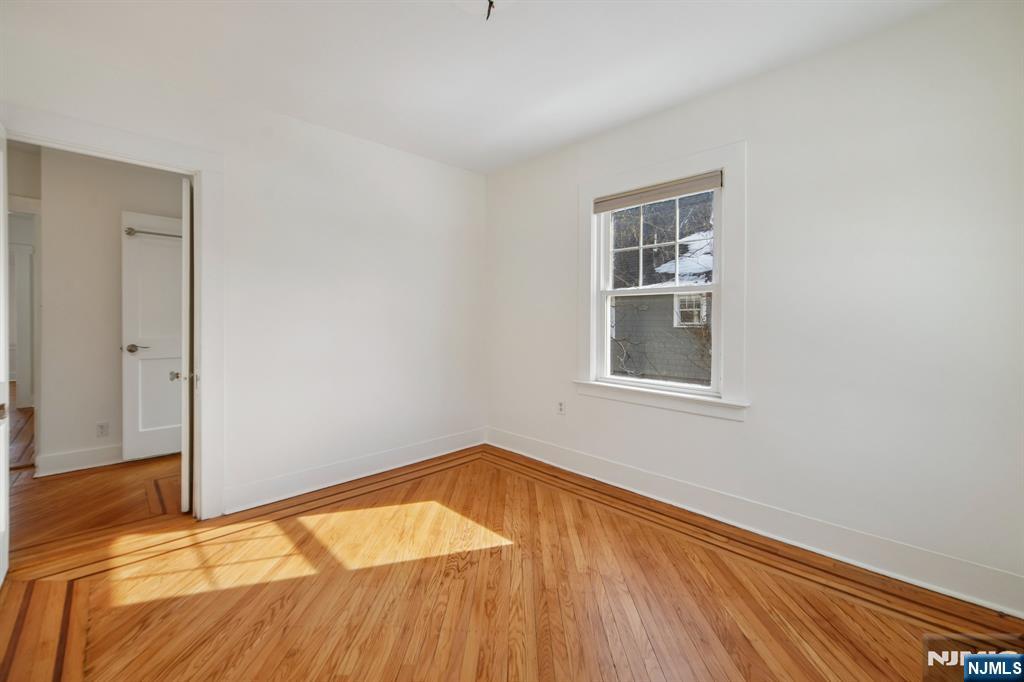42 Brookfield Road, Unit 2 Montclair, NJ 07043 - Photo 21 of 36 a view of empty room with wooden floor
