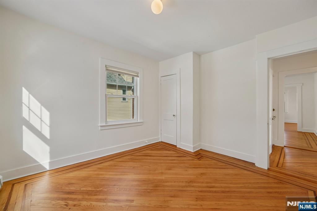 42 Brookfield Road, Unit 2 Montclair, NJ 07043 - Photo 23 of 36 a view of empty room with wooden floor and fan