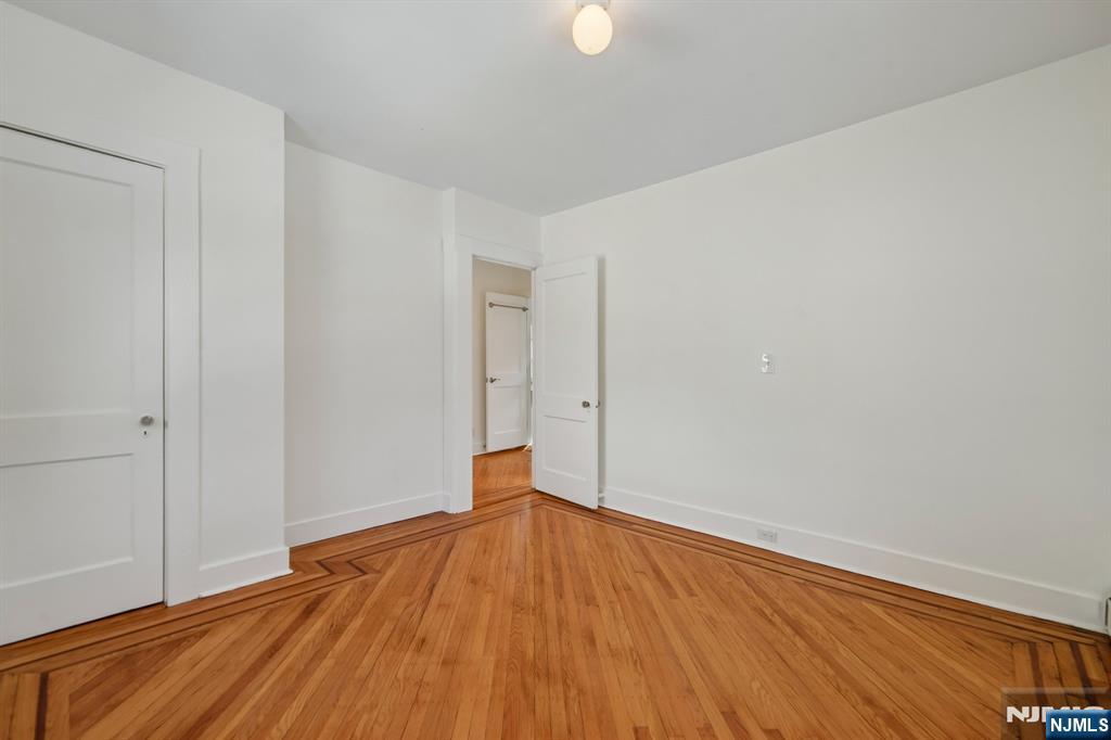 42 Brookfield Road, Unit 2 Montclair, NJ 07043 - Photo 24 of 36 a view of empty room with wooden floor