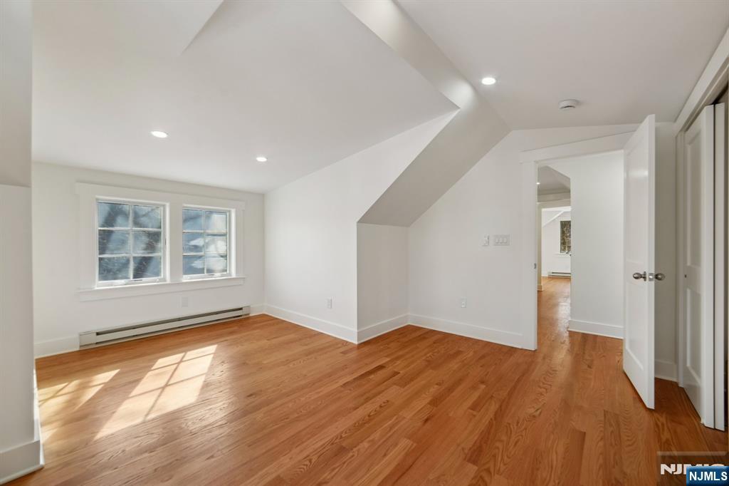 42 Brookfield Road, Unit 2 Montclair, NJ 07043 - Photo 27 of 36 a view of empty room with wooden floor and fan
