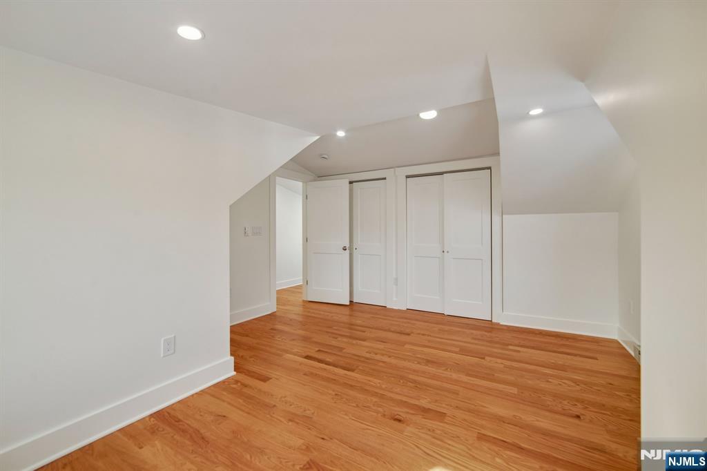 42 Brookfield Road, Unit 2 Montclair, NJ 07043 - Photo 28 of 36 a view of an empty room with wooden floor