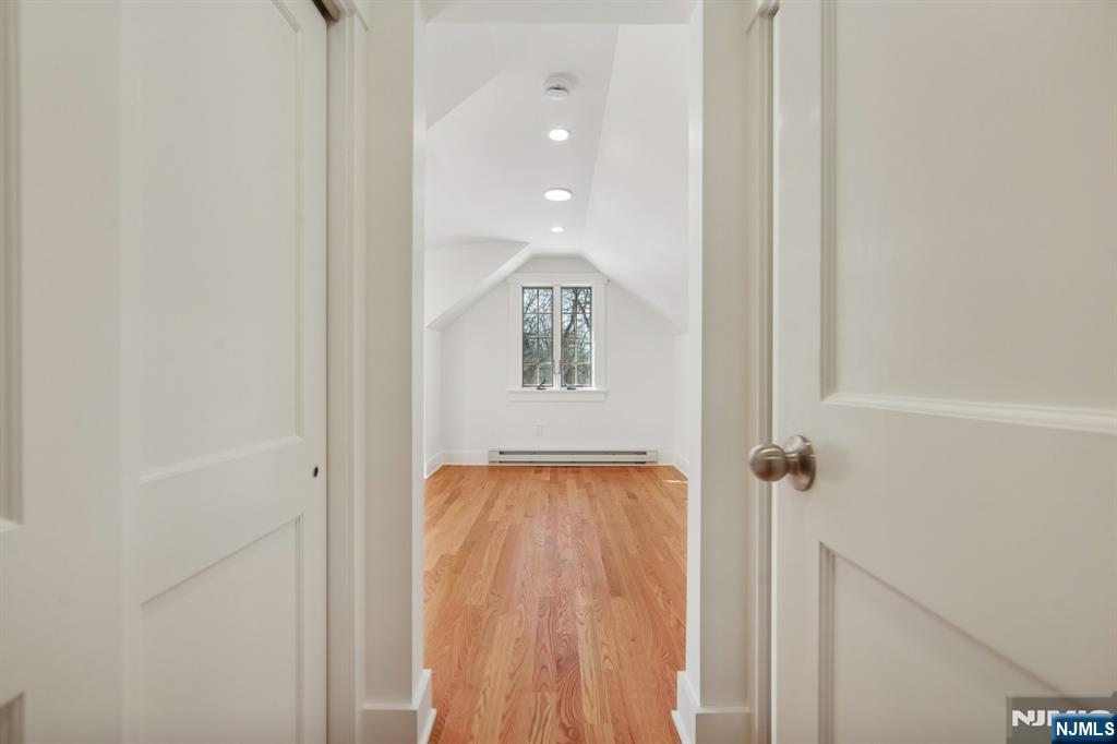 42 Brookfield Road, Unit 2 Montclair, NJ 07043 - Photo 32 of 36 a view of a hallway with wooden floor and staircase