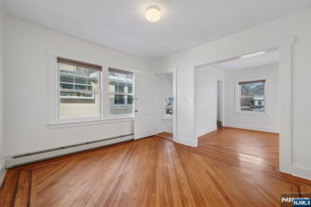 42 Brookfield Road, Unit 2 Montclair, NJ 07043 - Photo 4 of 36 a view of empty room with wooden floor and fan