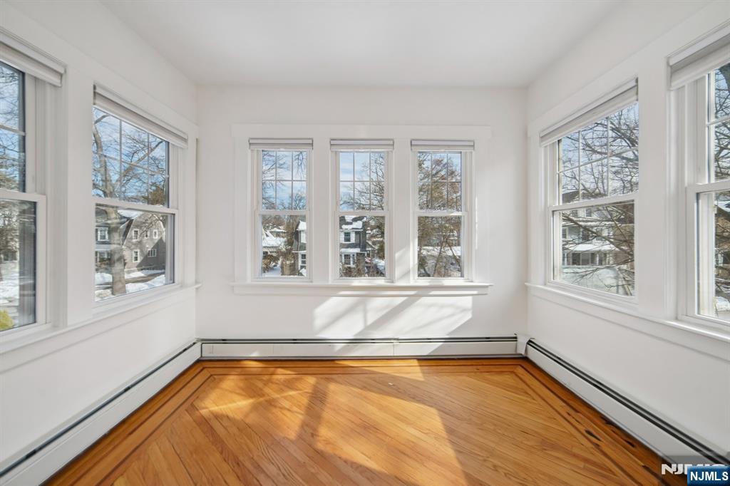 42 Brookfield Road, Unit 2 Montclair, NJ 07043 - Photo 10 of 36 a view of an empty room with a window and a kitchen